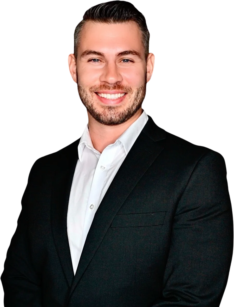 Dr. Anthony Fahsholtz, smiling, in a dark suit and white shirt